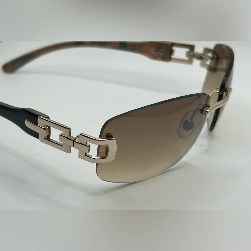 Vintage 90s Y2K Foster Grant Rimless gold link accent Sunglasses